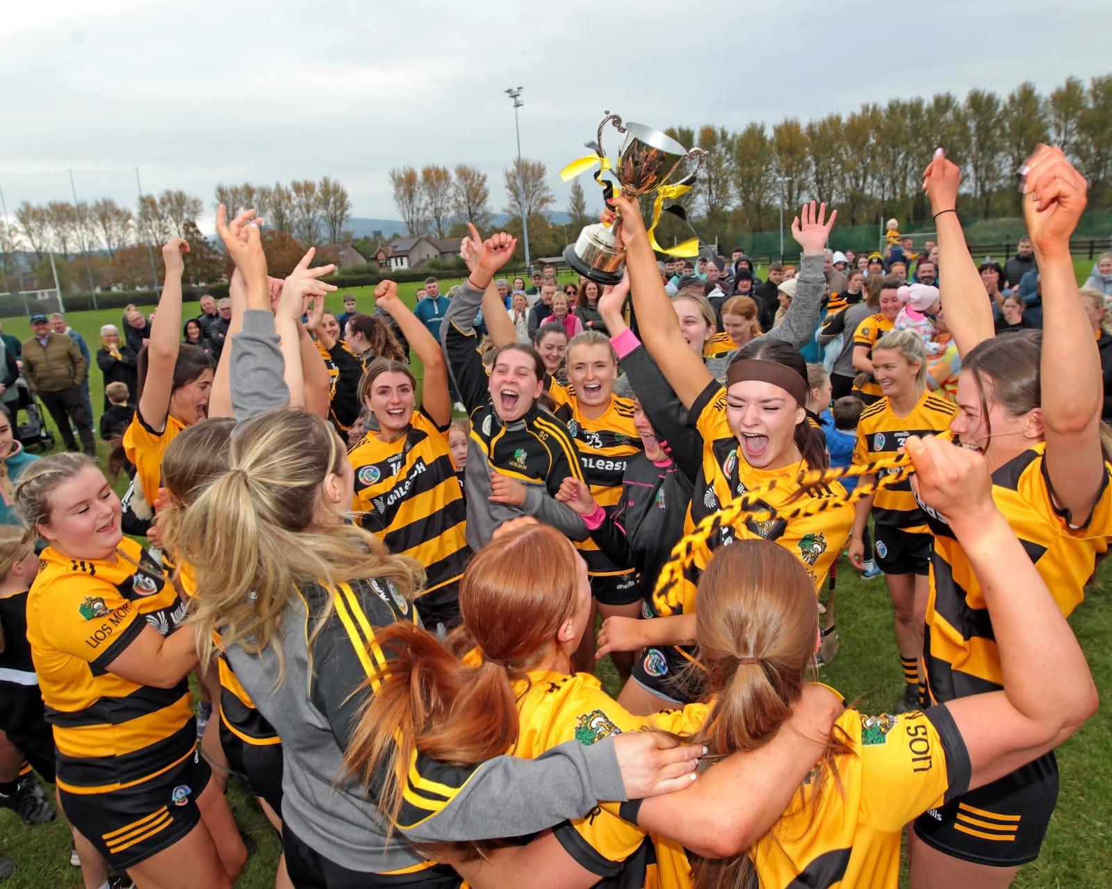 Lismore Camogie team celebrating a trophy
